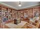 Library with custom built-in bookshelves covering the perimeter of the room at 1942 N Akin Ne Dr, Atlanta, GA 30345