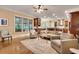 Open-concept living area seamlessly connects to the kitchen, featuring hardwood floors and large windows for natural light at 1942 N Akin Ne Dr, Atlanta, GA 30345