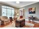 Living room with hardwood floors, a vintage chest, and a view to the front door at 1942 N Akin Ne Dr, Atlanta, GA 30345