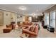 Spacious living room with comfortable seating, bookshelves, and a ping pong table at 1942 N Akin Ne Dr, Atlanta, GA 30345