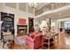 Spacious living room with a fireplace, hardwood floors, and a grand staircase leading to the second floor balcony at 1942 N Akin Ne Dr, Atlanta, GA 30345