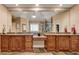 Elegant main bathroom with double sinks, granite countertops, tiled floors, and a jacuzzi tub at 1942 N Akin Ne Dr, Atlanta, GA 30345