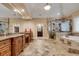 Luxurious main bathroom featuring double sinks, a walk-in shower, jacuzzi bathtub, and tiled flooring at 1942 N Akin Ne Dr, Atlanta, GA 30345