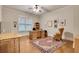 Bright home office with hardwood floors, ample desk space, and a comfortable armchair at 1942 N Akin Ne Dr, Atlanta, GA 30345