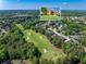 Community aerial view showcasing the golf course proximity and tree-lined neighborhood of the home at 3456 Glen Mist Pl, Dacula, GA 30019