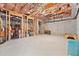 Unfinished basement with exposed ceiling, concrete walls, and lots of storage space at 3456 Glen Mist Pl, Dacula, GA 30019