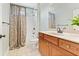 Well-appointed bathroom features a shower-tub combo and a modern vanity at 3456 Glen Mist Pl, Dacula, GA 30019