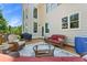 Cozy backyard deck with cushioned seating, a grill, and beautiful views of the trees at 3456 Glen Mist Pl, Dacula, GA 30019
