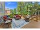 Relaxing deck area with comfortable outdoor furniture and peaceful backyard views at 3456 Glen Mist Pl, Dacula, GA 30019