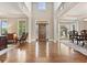 Hardwood entryway of home with soaring ceilings and view of adjacent rooms at 3456 Glen Mist Pl, Dacula, GA 30019