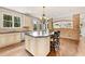 Spacious kitchen boasts a large island, granite countertops, and stainless steel appliances at 3456 Glen Mist Pl, Dacula, GA 30019