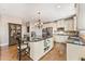 Elegant kitchen with stainless steel appliances, granite countertops, and a center island at 3456 Glen Mist Pl, Dacula, GA 30019