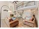 Inviting living room with wood floors, fireplace, and view of the second-floor balcony at 3456 Glen Mist Pl, Dacula, GA 30019