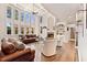 Bright living room with soaring ceiling, tall windows, fireplace and wood flooring at 3456 Glen Mist Pl, Dacula, GA 30019