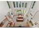 Bright living room with two story ceiling, fireplace, and lots of windows at 3456 Glen Mist Pl, Dacula, GA 30019