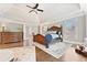 Bright main bedroom suite with vaulted ceiling, hardwood floors, and large windows at 3456 Glen Mist Pl, Dacula, GA 30019