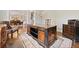 Traditional home office with wood desk, hardwood floors and decorative rug at 3456 Glen Mist Pl, Dacula, GA 30019