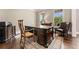 Office with desk and chair positioned on a patterned rug and hardwood floor at 3456 Glen Mist Pl, Dacula, GA 30019