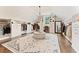 Impressive walk-in closet with custom shelving, center island, and chandelier at 3456 Glen Mist Pl, Dacula, GA 30019