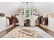 Large walk-in closet features custom storage, vanity, and mirror at 3456 Glen Mist Pl, Dacula, GA 30019