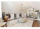 Spacious walk-in closet features custom storage, chandelier, and large mirror at 3456 Glen Mist Pl, Dacula, GA 30019