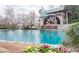 Scenic view of a pond and water mill feature with beautiful landscape at 3456 Glen Mist Pl, Dacula, GA 30019