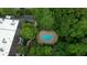 Overhead view of the community pool, surrounded by trees at 107 Ridley Howard Ct, Decatur, GA 30030
