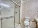 Bright bathroom showing a standard toilet and a glass framed shower with tile surround at 107 Ridley Howard Ct, Decatur, GA 30030