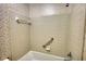 A dated bathroom features a tiled shower and floral wallpaper at 107 Ridley Howard Ct, Decatur, GA 30030
