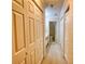 Hallway view showing multiple closet doors and an open door leading to a bathroom at 107 Ridley Howard Ct, Decatur, GA 30030
