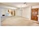 Spacious living room with mirrored wall and view of the kitchen provides a cozy space at 107 Ridley Howard Ct, Decatur, GA 30030