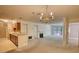 Open floor plan with fireplace and kitchen provides a cozy space at 107 Ridley Howard Ct, Decatur, GA 30030