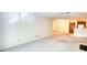 Spacious living room with mirrored wall and view of the kitchen provides a cozy space at 107 Ridley Howard Ct, Decatur, GA 30030
