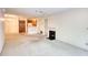 Open floor plan with fireplace and kitchen provides a cozy space at 107 Ridley Howard Ct, Decatur, GA 30030