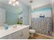 Charming bathroom with nautical themed shower curtain and vanity at 1560 Gilstrap Nw Ln, Atlanta, GA 30318