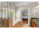 Luxurious bathroom with soaking tub, glass-enclosed shower, and elegant finishes at 1560 Gilstrap Nw Ln, Atlanta, GA 30318