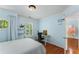 Bright bedroom featuring hardwood floors, built-in shelving, and a round window at 1560 Gilstrap Nw Ln, Atlanta, GA 30318