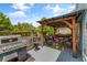 Spacious deck with outdoor kitchen and pergola-covered seating area, great for entertaining at 1560 Gilstrap Nw Ln, Atlanta, GA 30318