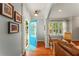 Welcoming foyer with hardwood floors, bright blue door, and stylish decor at 1560 Gilstrap Nw Ln, Atlanta, GA 30318