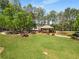 Gazebo in a park with picnic tables and benches, surrounded by trees and greenery. A great place to relax and enjoy the outdoors at 1560 Gilstrap Nw Ln, Atlanta, GA 30318