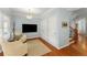 Cozy living area with natural light, comfortable seating, and convenient access to staircase at 1560 Gilstrap Nw Ln, Atlanta, GA 30318