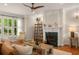 Beautiful living room with hardwood floors, a fireplace, and comfortable seating at 1560 Gilstrap Nw Ln, Atlanta, GA 30318