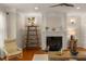 Elegant living room showcasing a fireplace, hardwood floors, and modern decor at 1560 Gilstrap Nw Ln, Atlanta, GA 30318