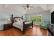 Spacious main bedroom features a tray ceiling, hardwood floors, and serene natural light at 1560 Gilstrap Nw Ln, Atlanta, GA 30318