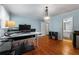 Office space with hardwood floors, a large desk, and adjacent access to a bathroom at 1560 Gilstrap Nw Ln, Atlanta, GA 30318