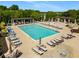 Community pool featuring plenty of seating and umbrellas under a clear blue sky at 1560 Gilstrap Nw Ln, Atlanta, GA 30318