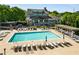 Expansive community pool with ample lounge chairs and a well-maintained surrounding area at 1560 Gilstrap Nw Ln, Atlanta, GA 30318