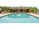 Relaxing poolside scene with lounge chairs under a shaded structure for comfort and leisure by the blue water at 1560 Gilstrap Nw Ln, Atlanta, GA 30318