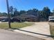 Wide shot of two-story home with mature trees and driveway; several cars visible at 2079 Bencal Se Dr, Atlanta, GA 30316