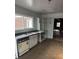 Bright kitchen features a double sink, white cabinets, and modern countertops at 2079 Bencal Se Dr, Atlanta, GA 30316